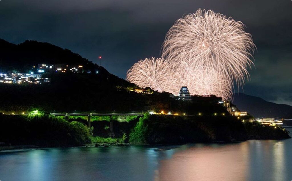 Atami Marine Fireworks Festival seen through mountain silhouettes